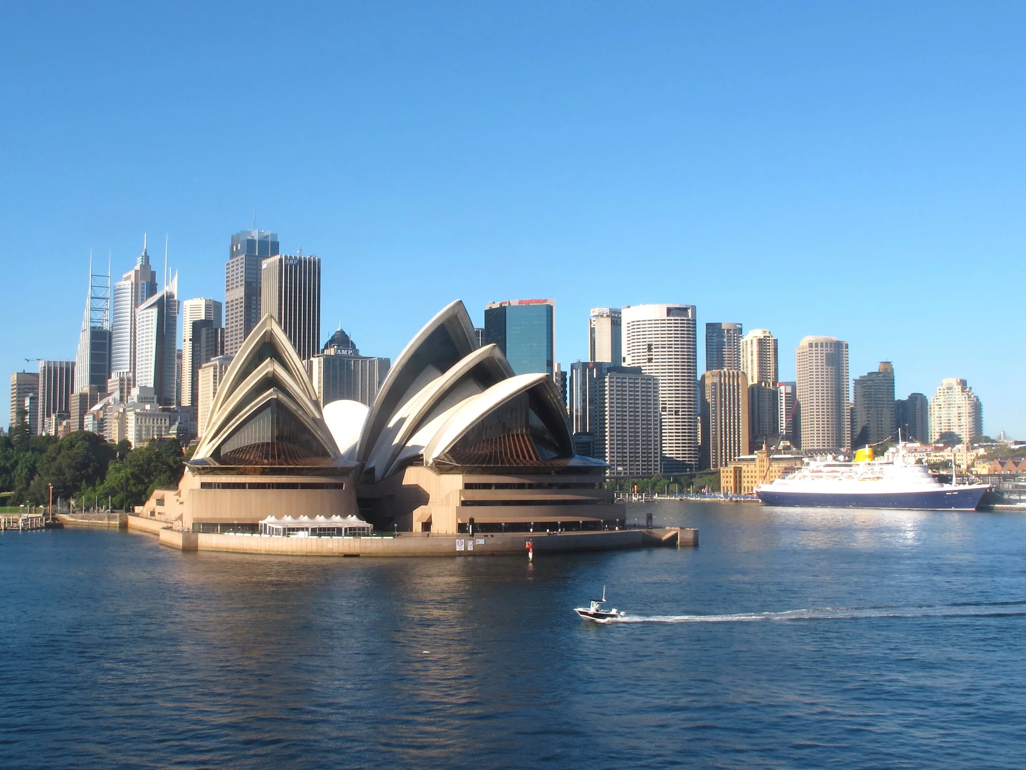 Sydney Opera House and city skyline beside the harbour