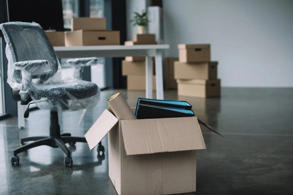 Office furniture and boxes prepared for a corporate move