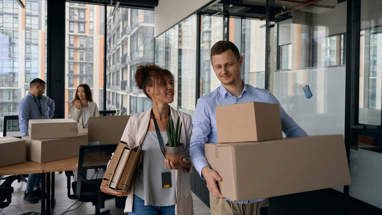 Office team packing boxes during a corporate relocation