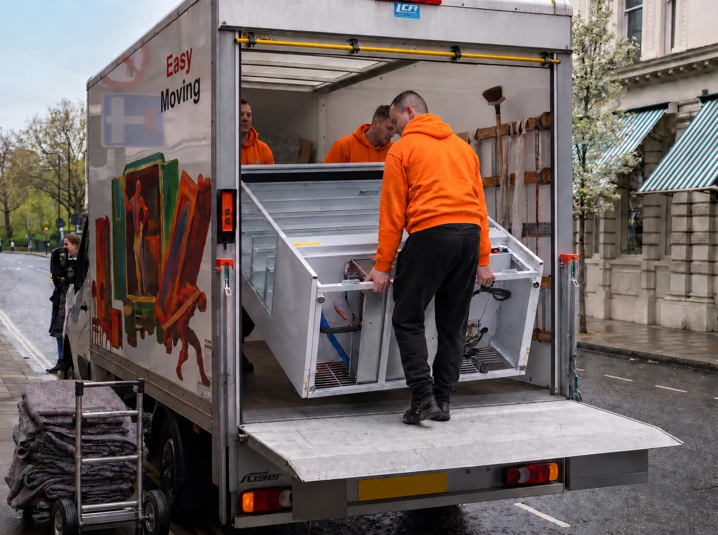 Easy Moving crew loading specialist equipment into a removal truck