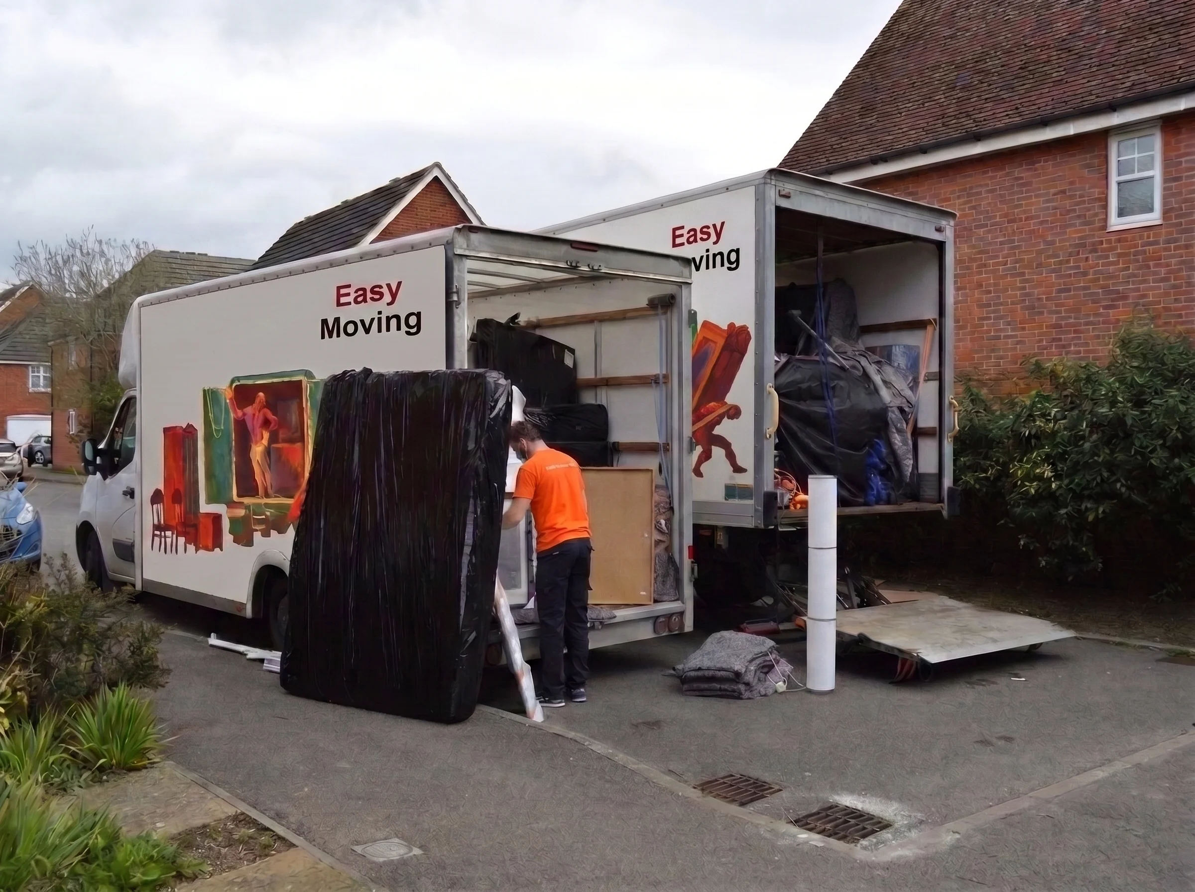 Easy Moving crew loading protected furniture into two removal vans