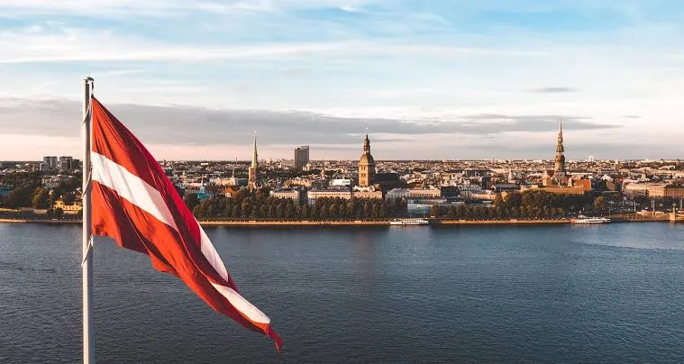 Latvian flag overlooking Riga and the Daugava River