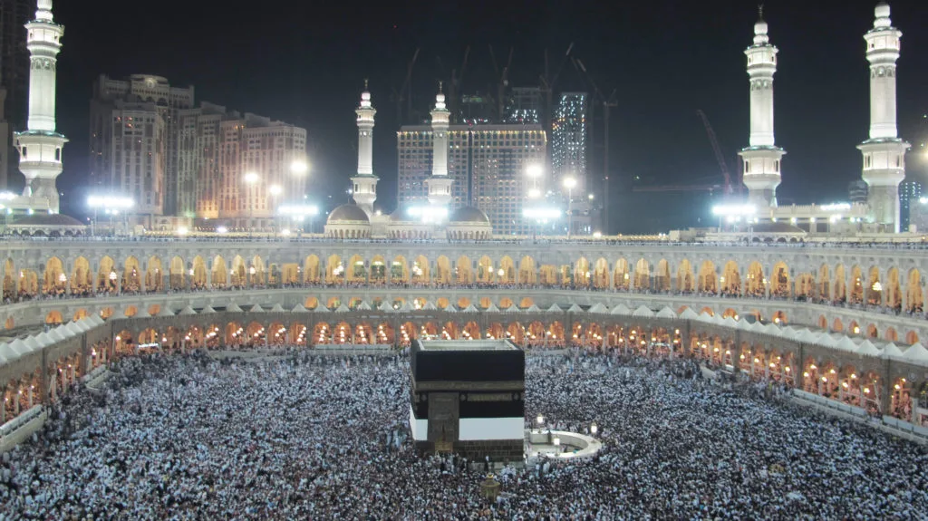 Mecca at night with the Grand Mosque and surrounding city lights