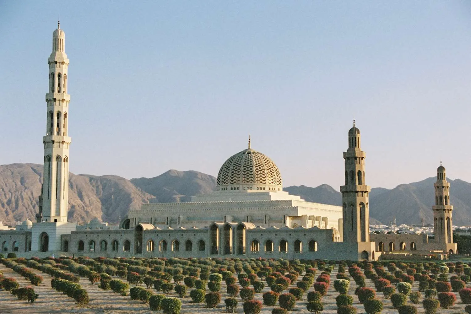 Sultan Qaboos Grand Mosque with mountains behind