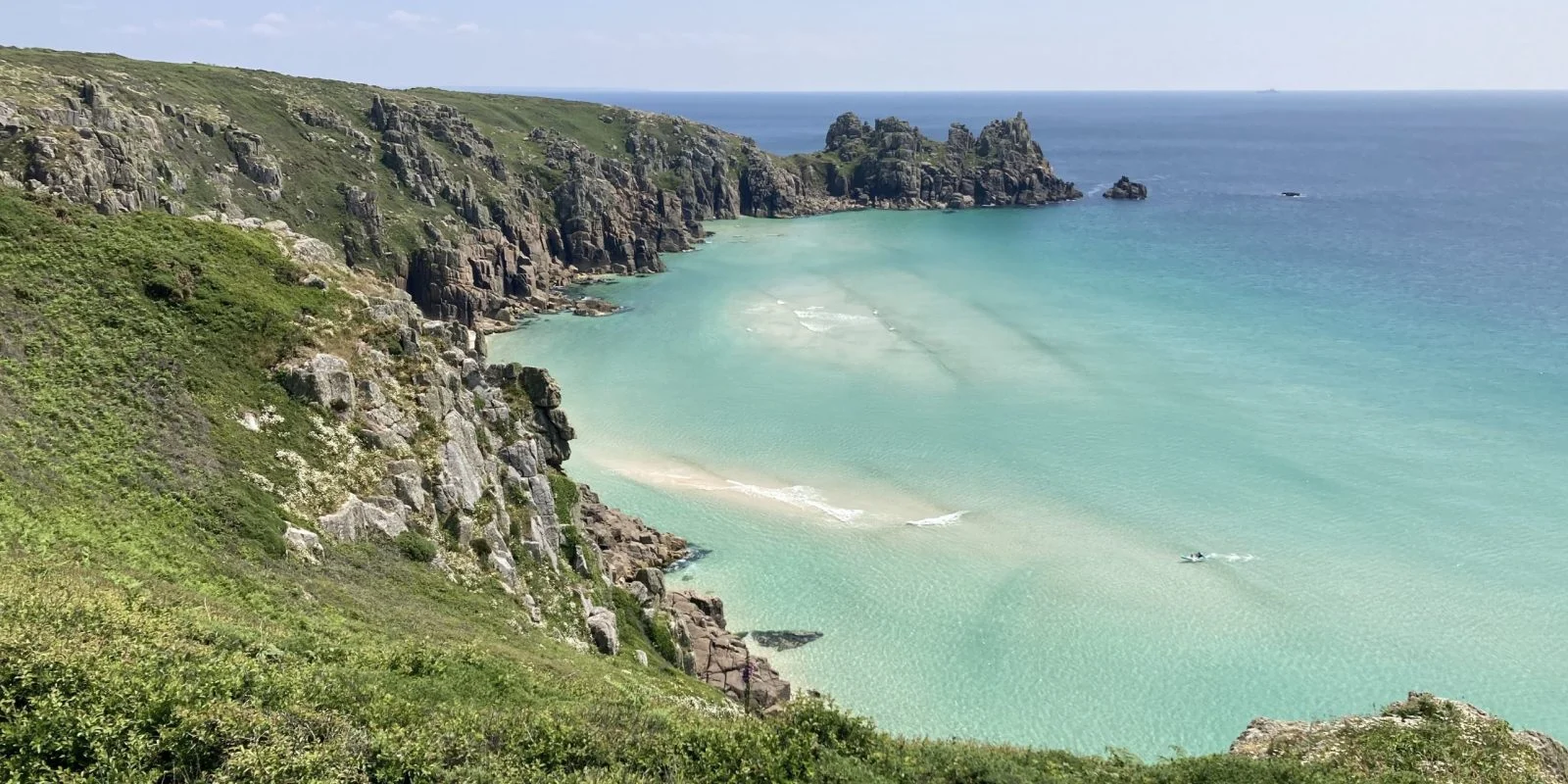 Turquoise sea and rocky coastline in Cornwall in the South West