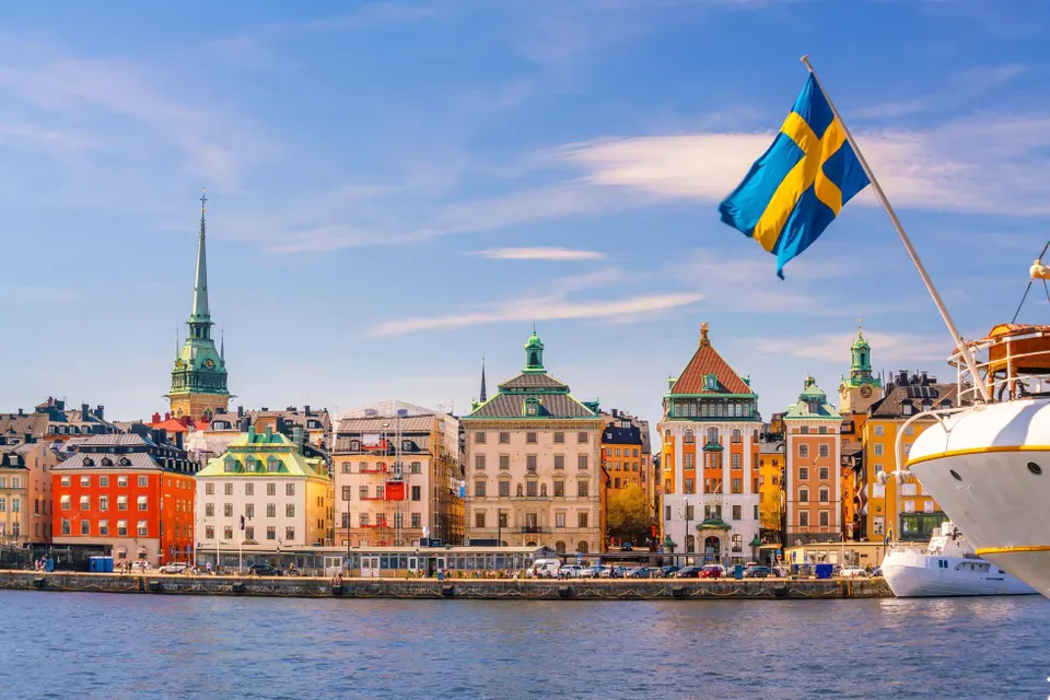 Swedish flag flying above the Stockholm waterfront