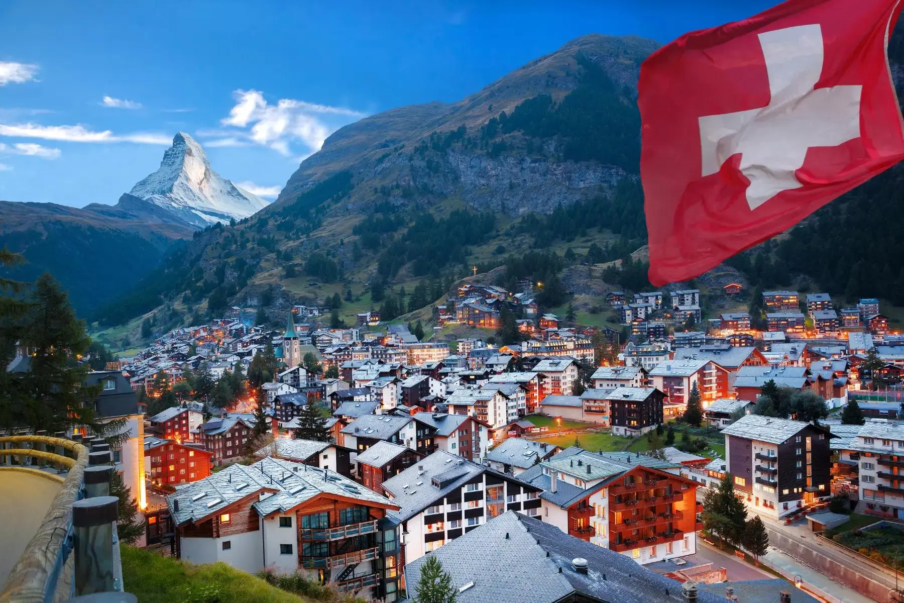 Swiss alpine village near the Matterhorn with a Switzerland flag