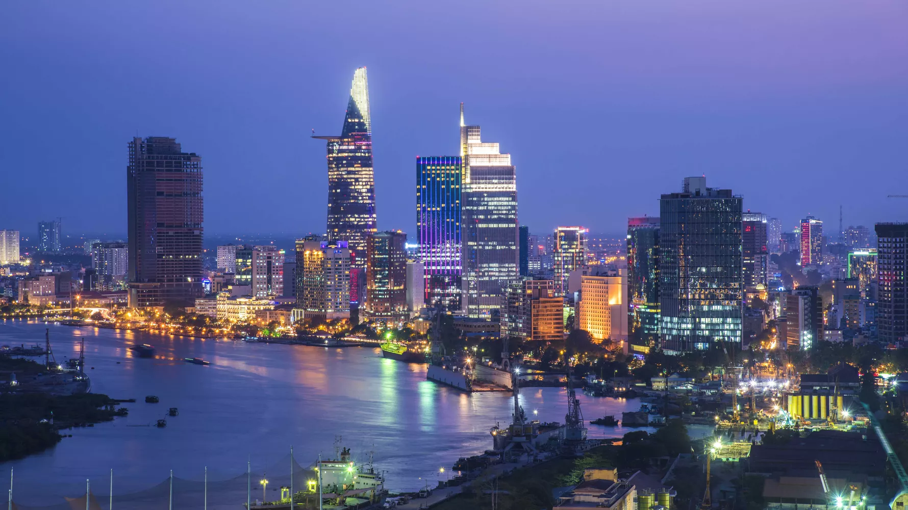 Ho Chi Minh City skyline at night beside the river